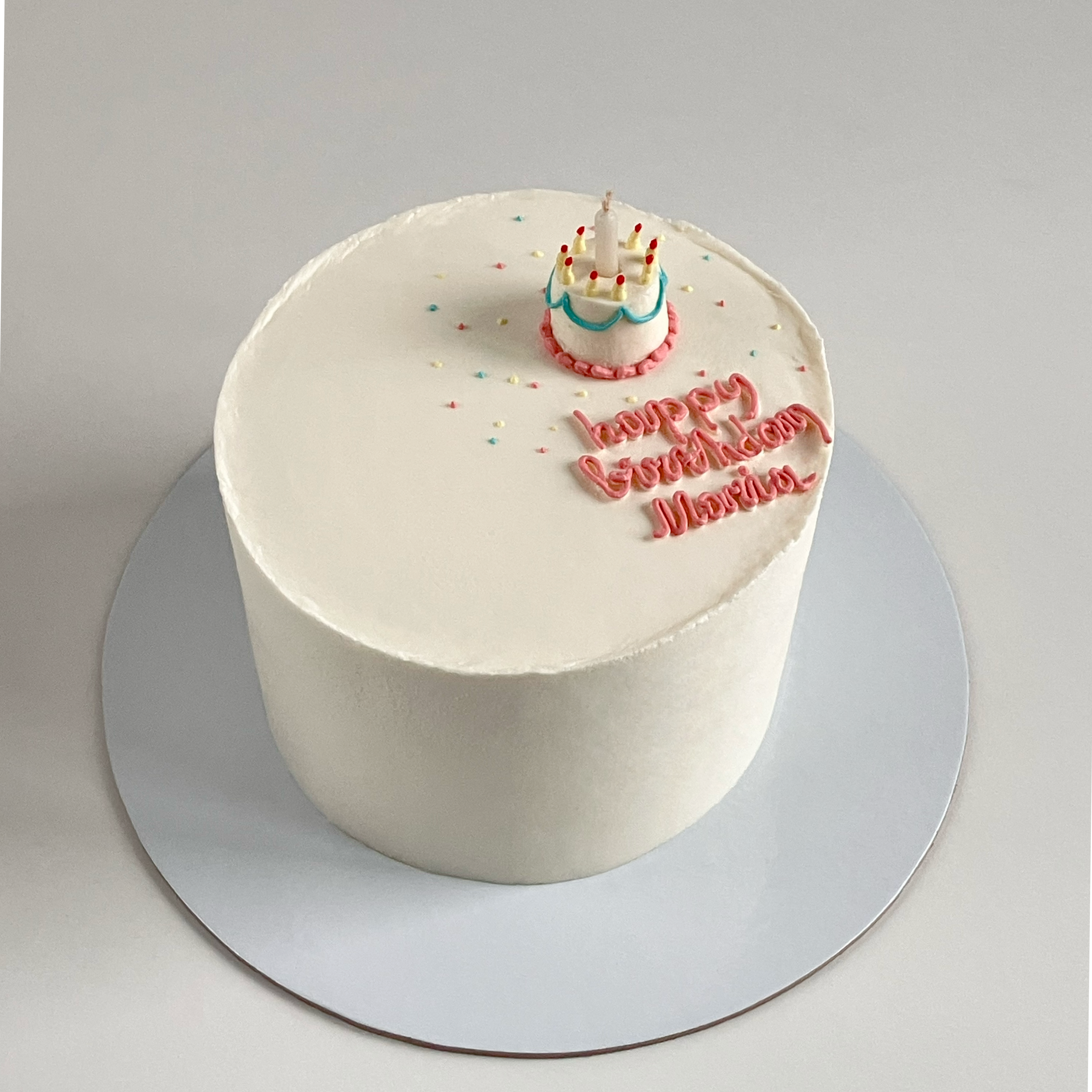 Torta sa malim tortom na vrhu